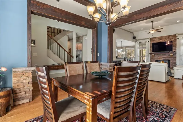 a dining room with furniture and wooden floor