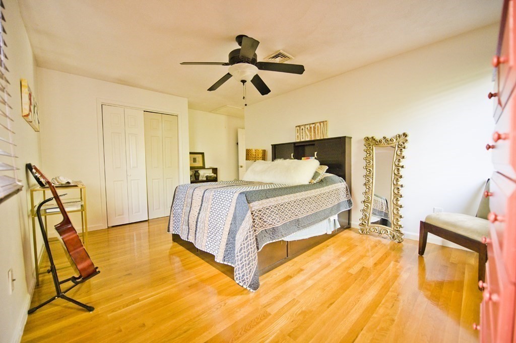 16 Warren Avenue Newton, MA 02465 - Photo 40 of 42 a bedroom with a bed and wooden floor