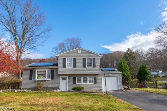 a front view of a house with swimming pool