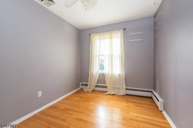 a view of room with toys and wooden floor