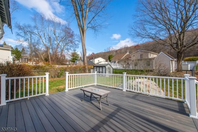a view of a chair and tables on the roof deck