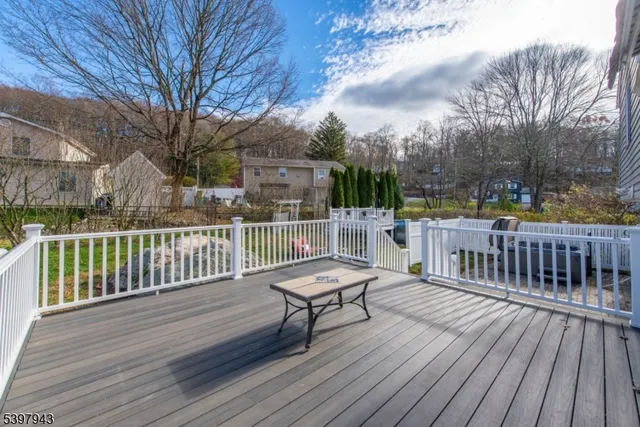 a view of backyard of house with green space