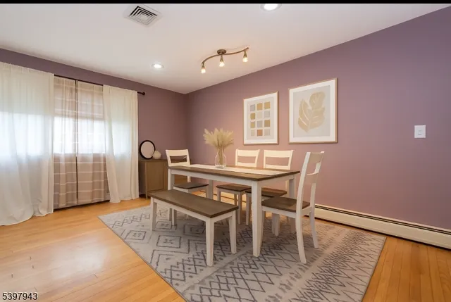 a dining room with furniture and window