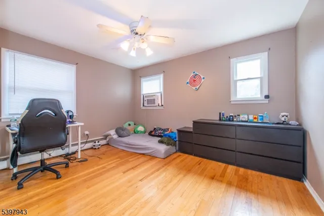 a bedroom with a bed closet and a window