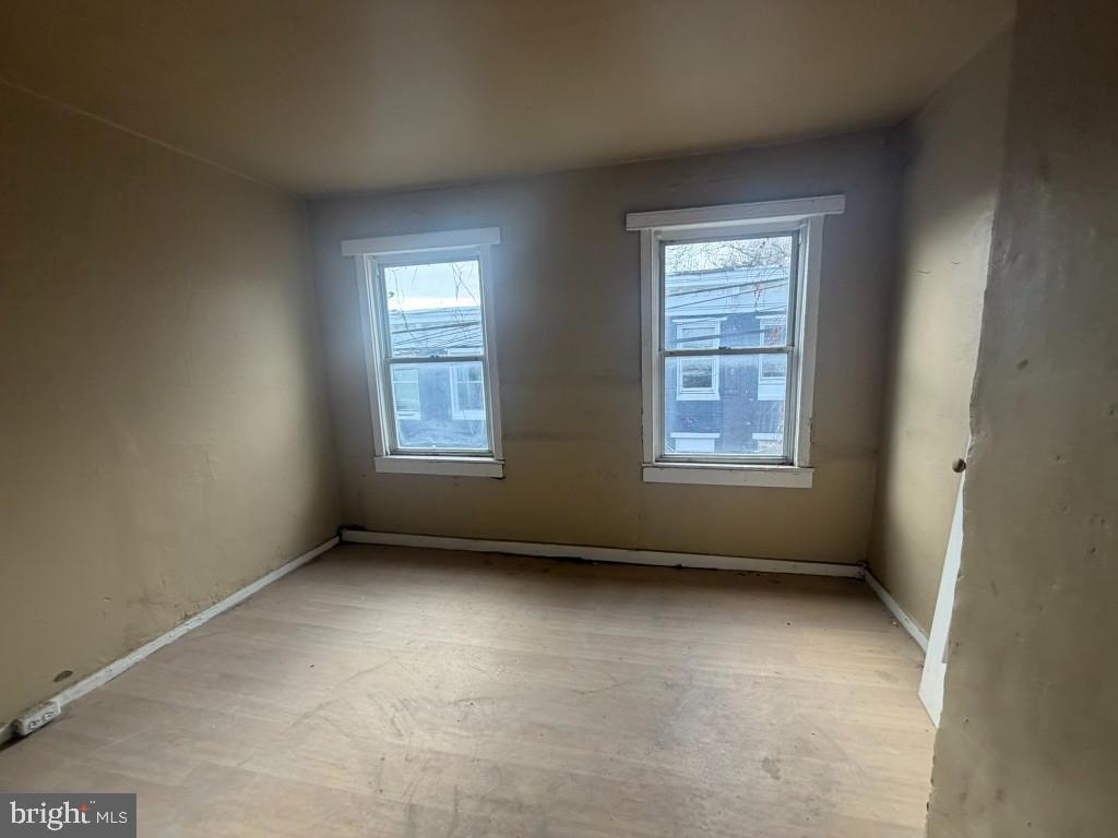 1610 Lemmon Street Baltimore, MD 21223 - Photo 17 of 22 a view of an empty room with a window