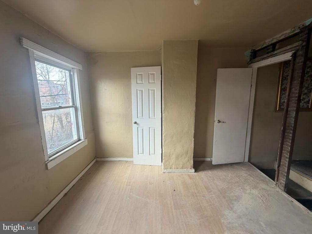 1610 Lemmon Street Baltimore, MD 21223 - Photo 18 of 22 an empty room with windows and closet