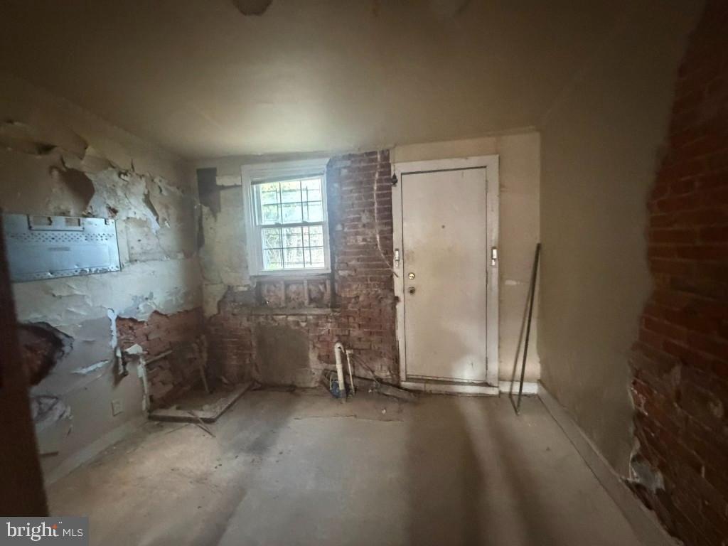 1610 Lemmon Street Baltimore, MD 21223 - Photo 8 of 22 an empty room with windows