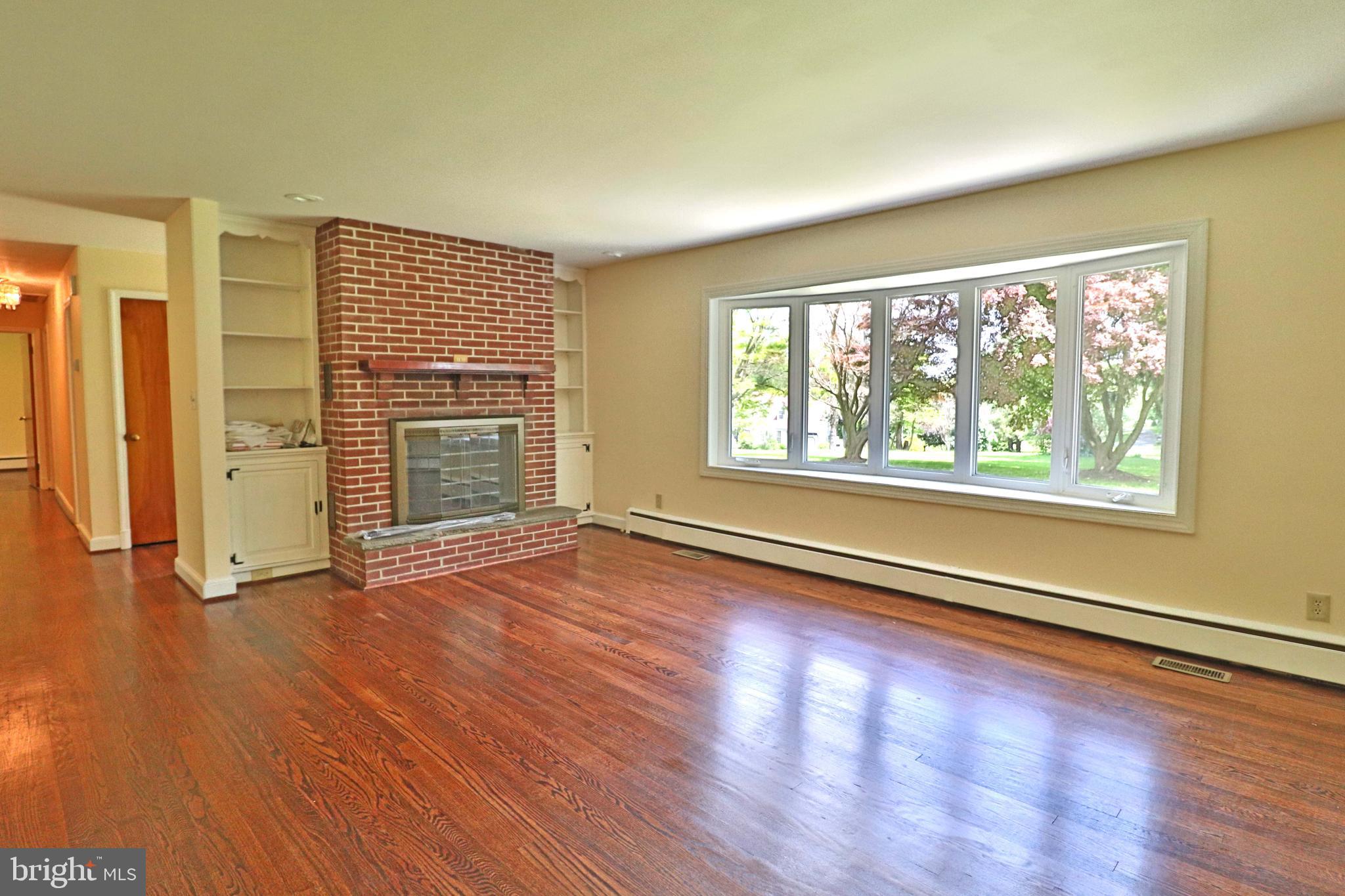 6708 Cherry Hill Road Baldwin, MD 21013 - Photo 2 of 44 an empty room with wooden floor and windows