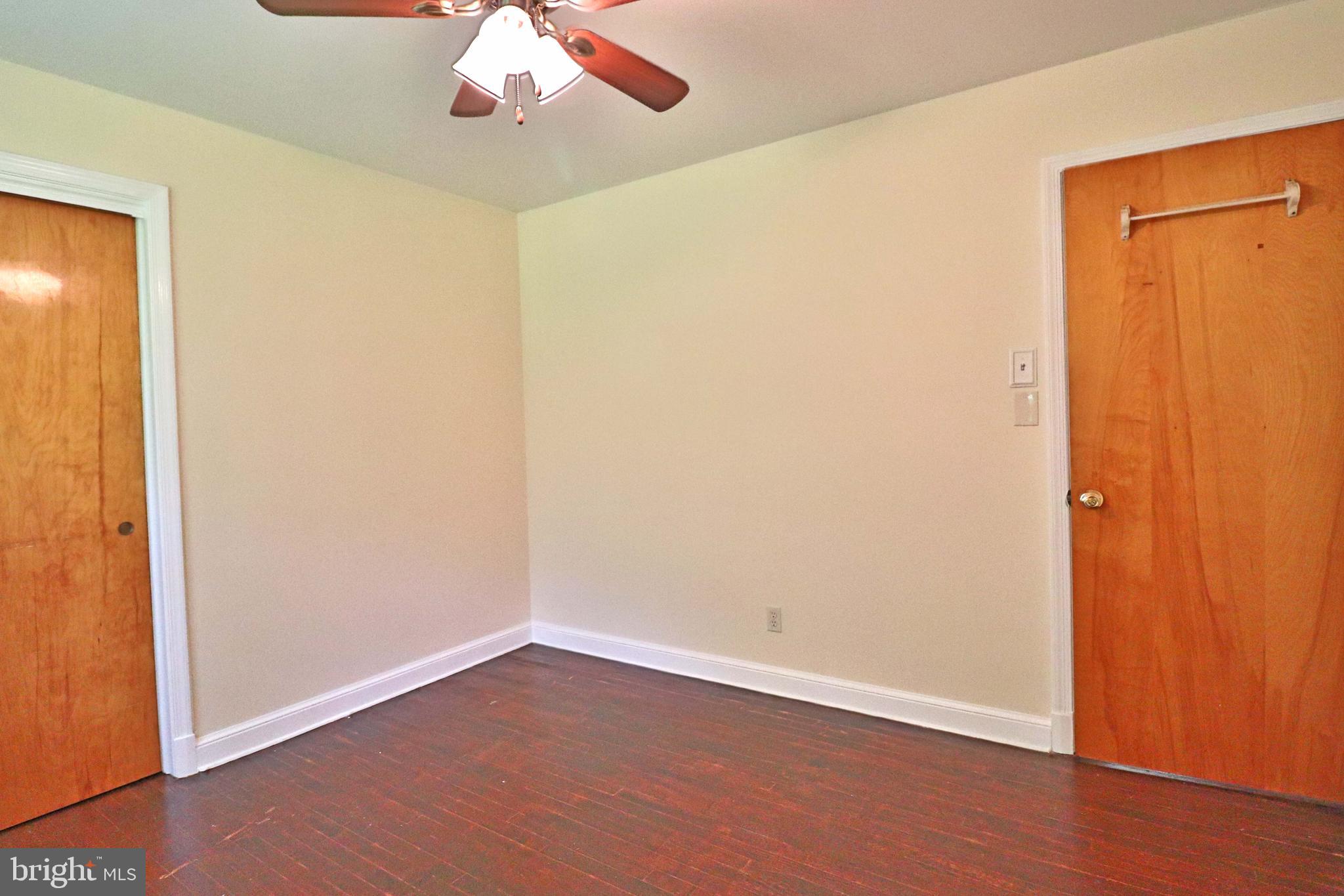 6708 Cherry Hill Road Baldwin, MD 21013 - Photo 14 of 44 an empty room with wooden floor closet and windows