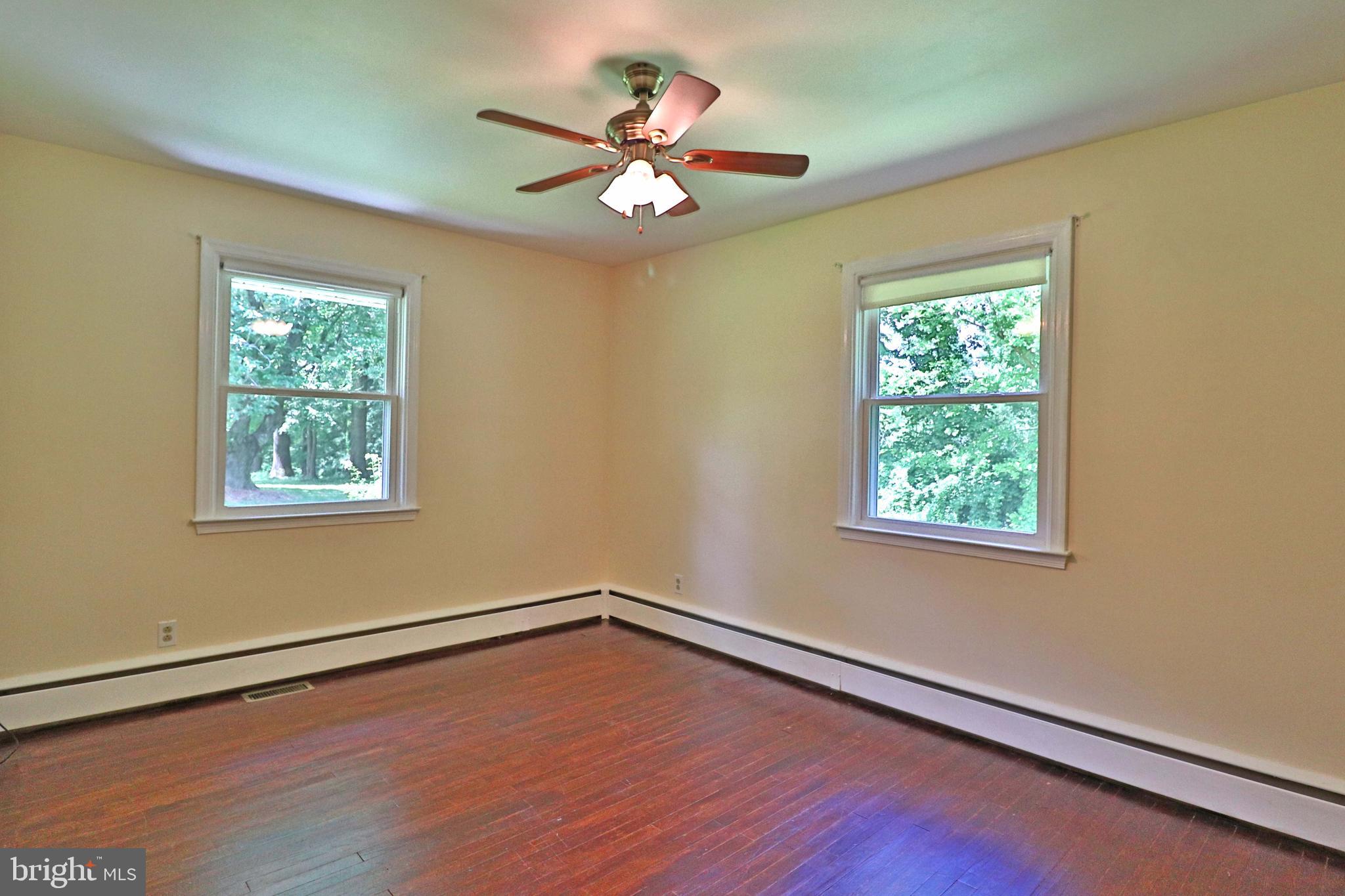 6708 Cherry Hill Road Baldwin, MD 21013 - Photo 15 of 44 a view of an empty room with wooden floor and a window