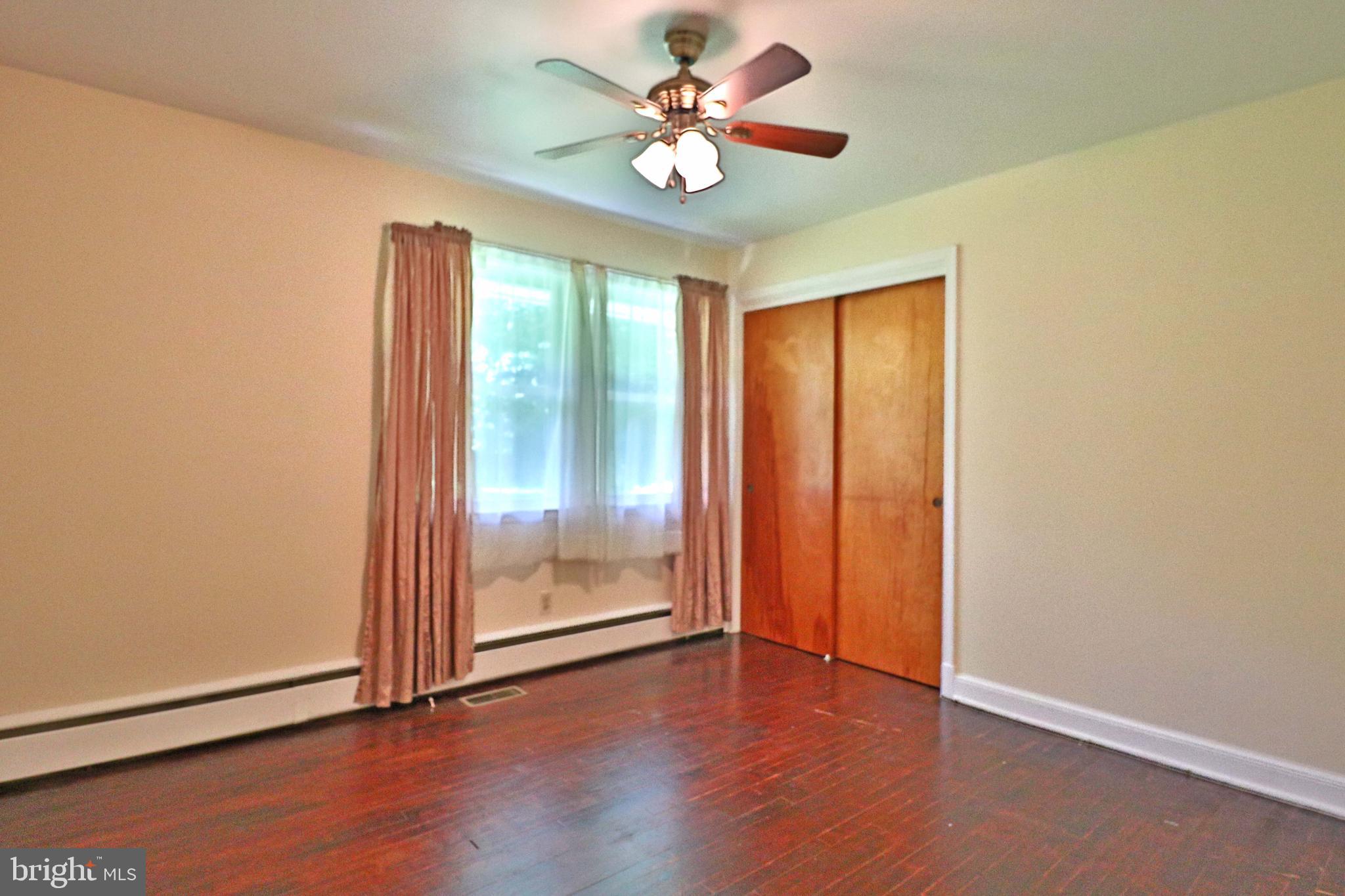 6708 Cherry Hill Road Baldwin, MD 21013 - Photo 20 of 44 an empty room with wooden floor and door