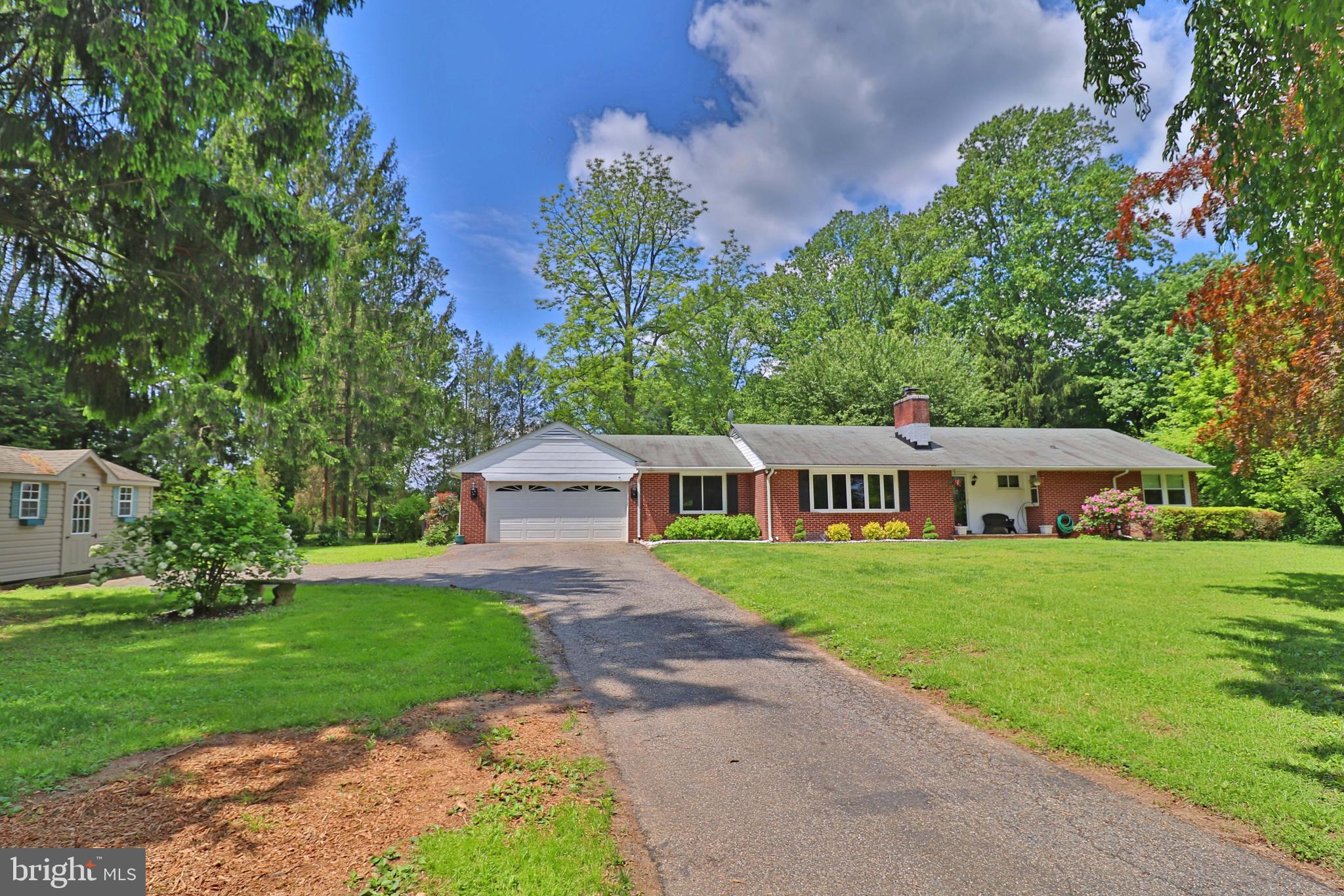 6708 Cherry Hill Road Baldwin, MD 21013 - Photo 36 of 44 a front view of a house with a yard and trees