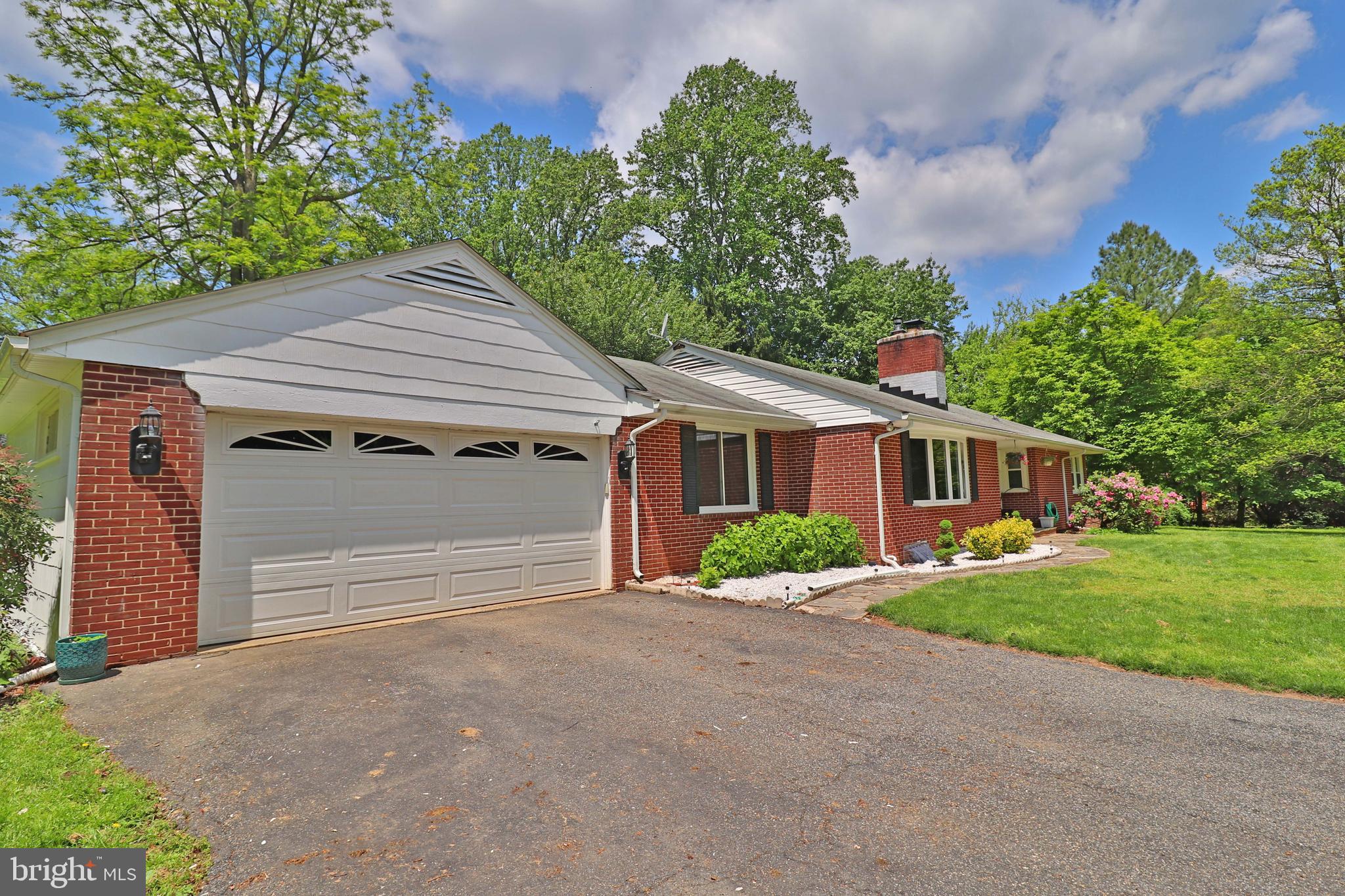 6708 Cherry Hill Road Baldwin, MD 21013 - Photo 39 of 44 a front view of a house with a yard and garage