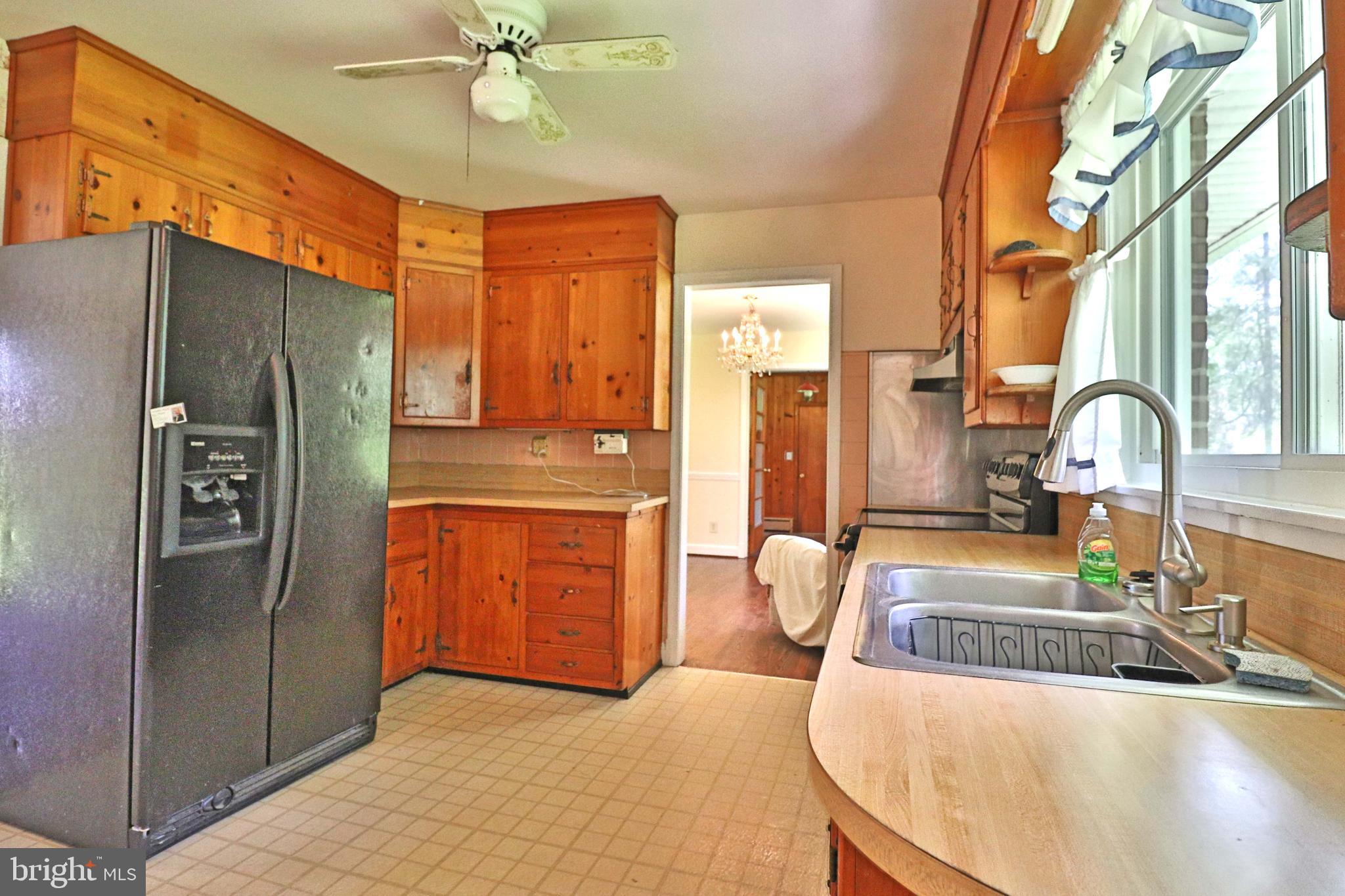 6708 Cherry Hill Road Baldwin, MD 21013 - Photo 5 of 44 a kitchen with stainless steel appliances granite countertop a refrigerator and a sink