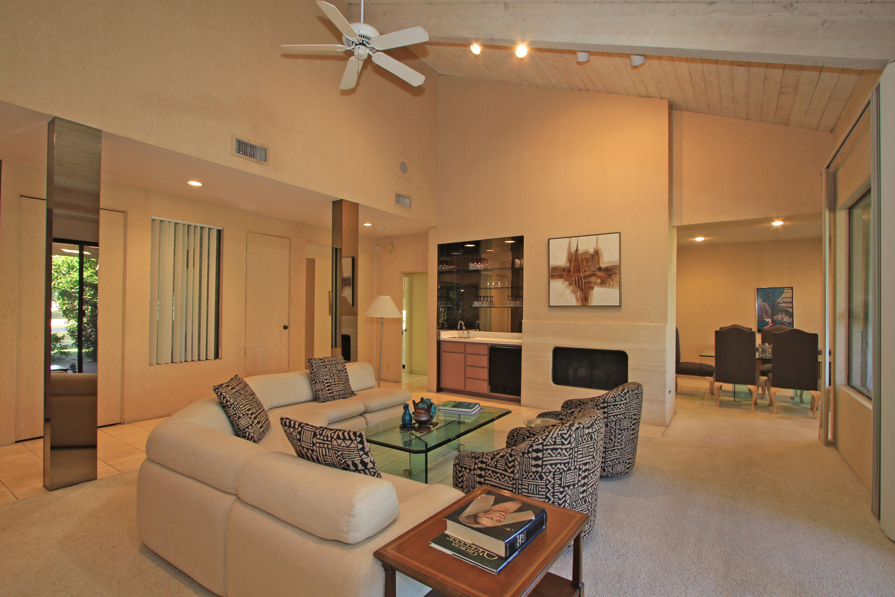 924 Inverness Drive Rancho Mirage, CA 92270 - Photo 12 of 44 a living room with furniture and a fireplace