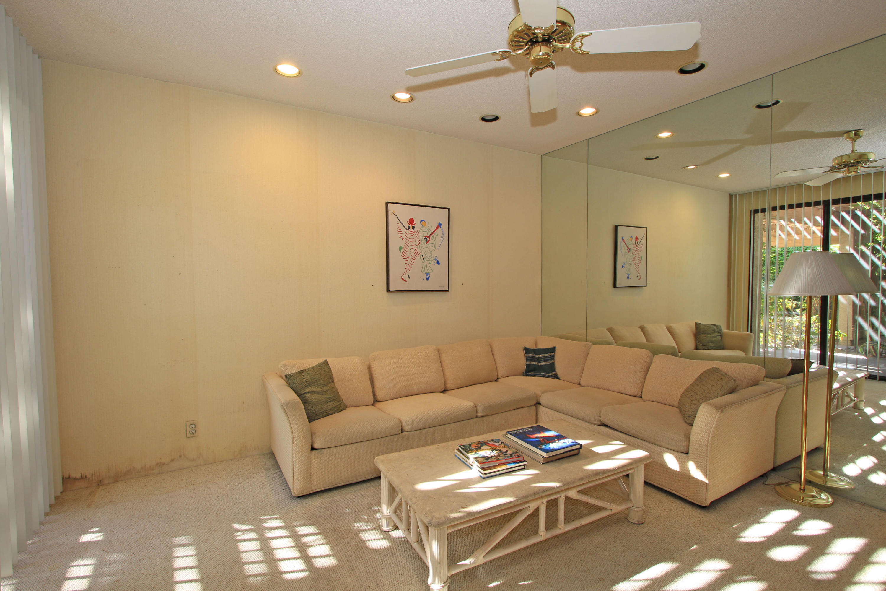 924 Inverness Drive Rancho Mirage, CA 92270 - Photo 17 of 44 a living room with furniture and a chandelier