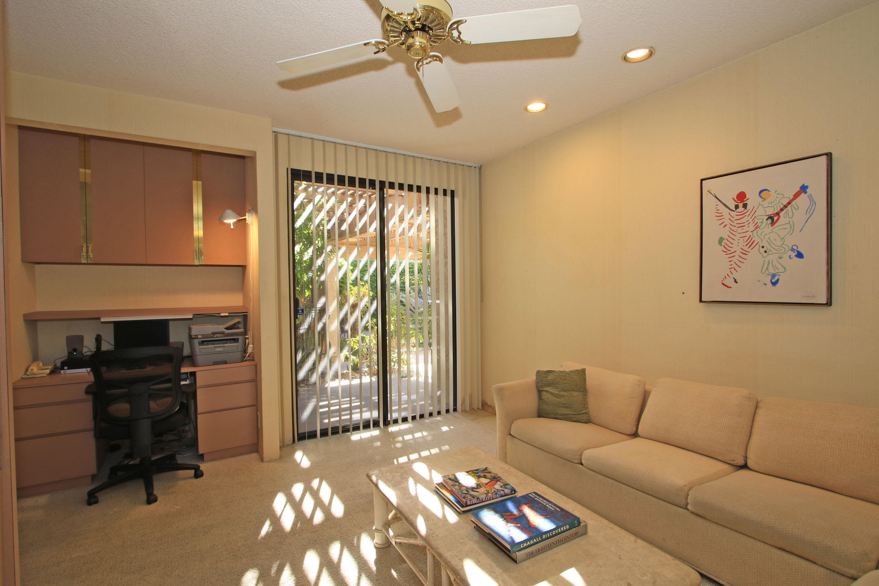 924 Inverness Drive Rancho Mirage, CA 92270 - Photo 18 of 44 a living room with furniture and a flat screen tv
