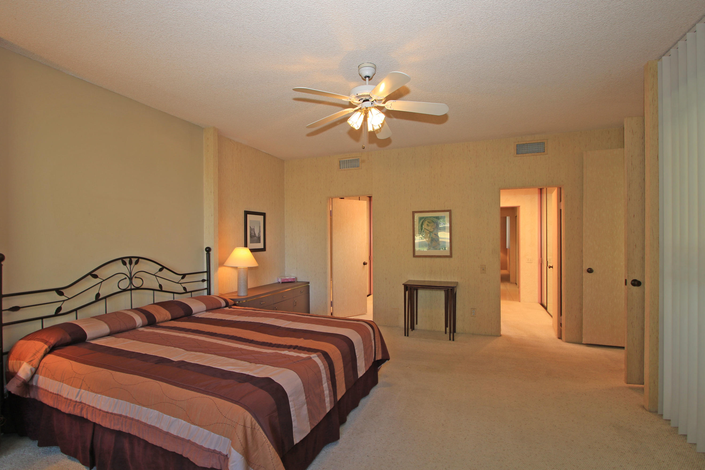 924 Inverness Drive Rancho Mirage, CA 92270 - Photo 21 of 44 a bedroom with a bed and a fireplace