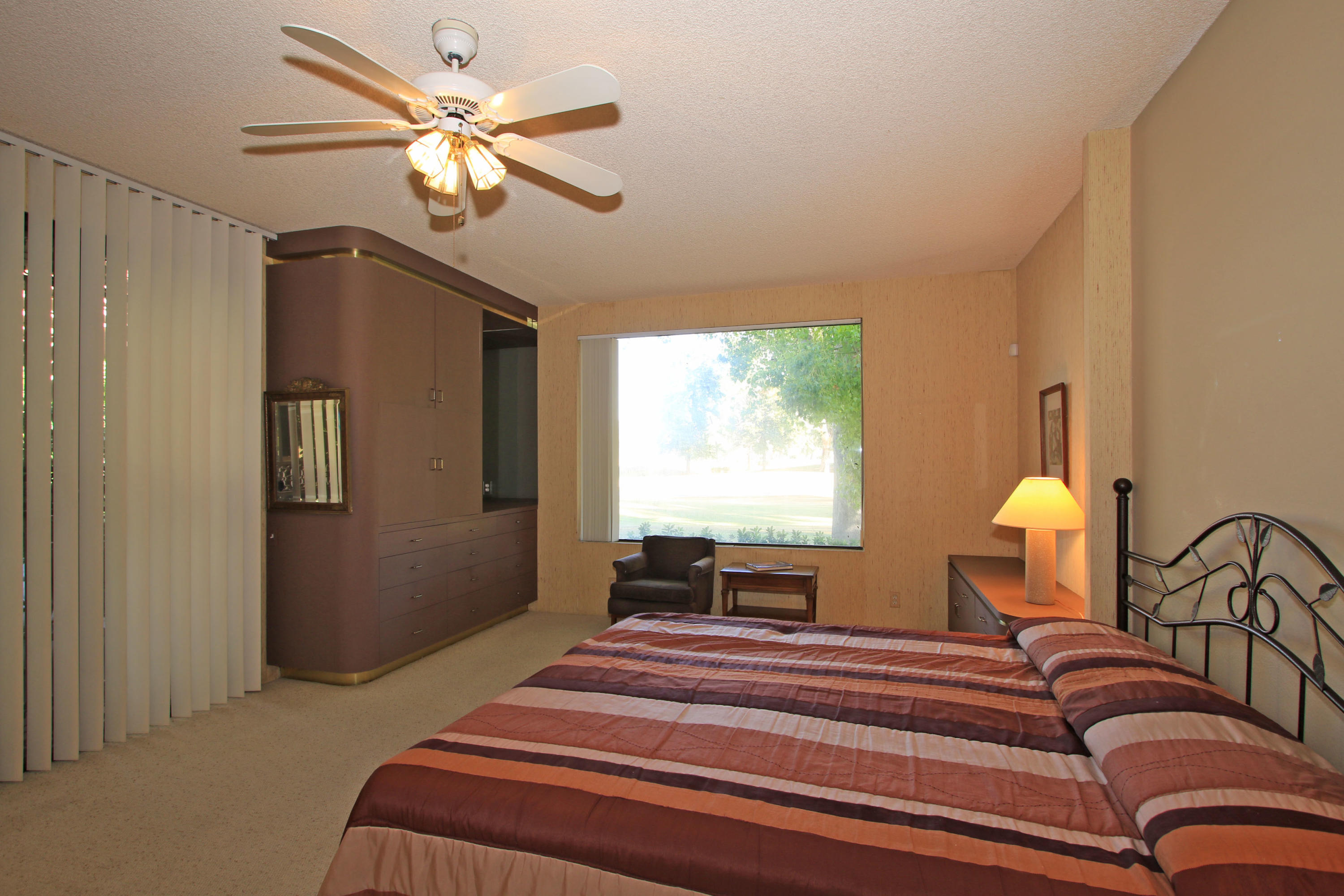 924 Inverness Drive Rancho Mirage, CA 92270 - Photo 23 of 44 a bedroom with a bed and dresser