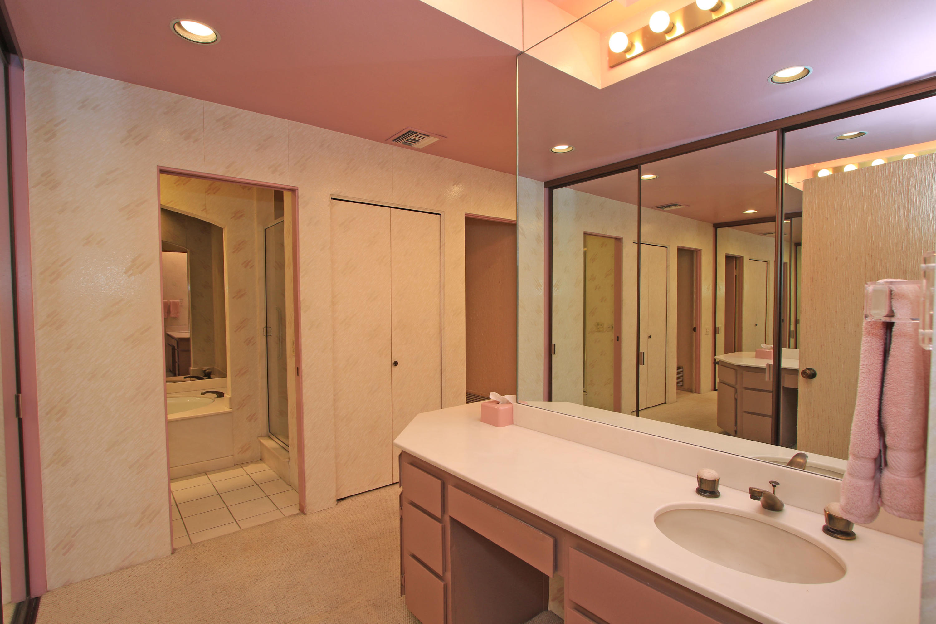 924 Inverness Drive Rancho Mirage, CA 92270 - Photo 24 of 44 a bathroom with a sink and a mirror