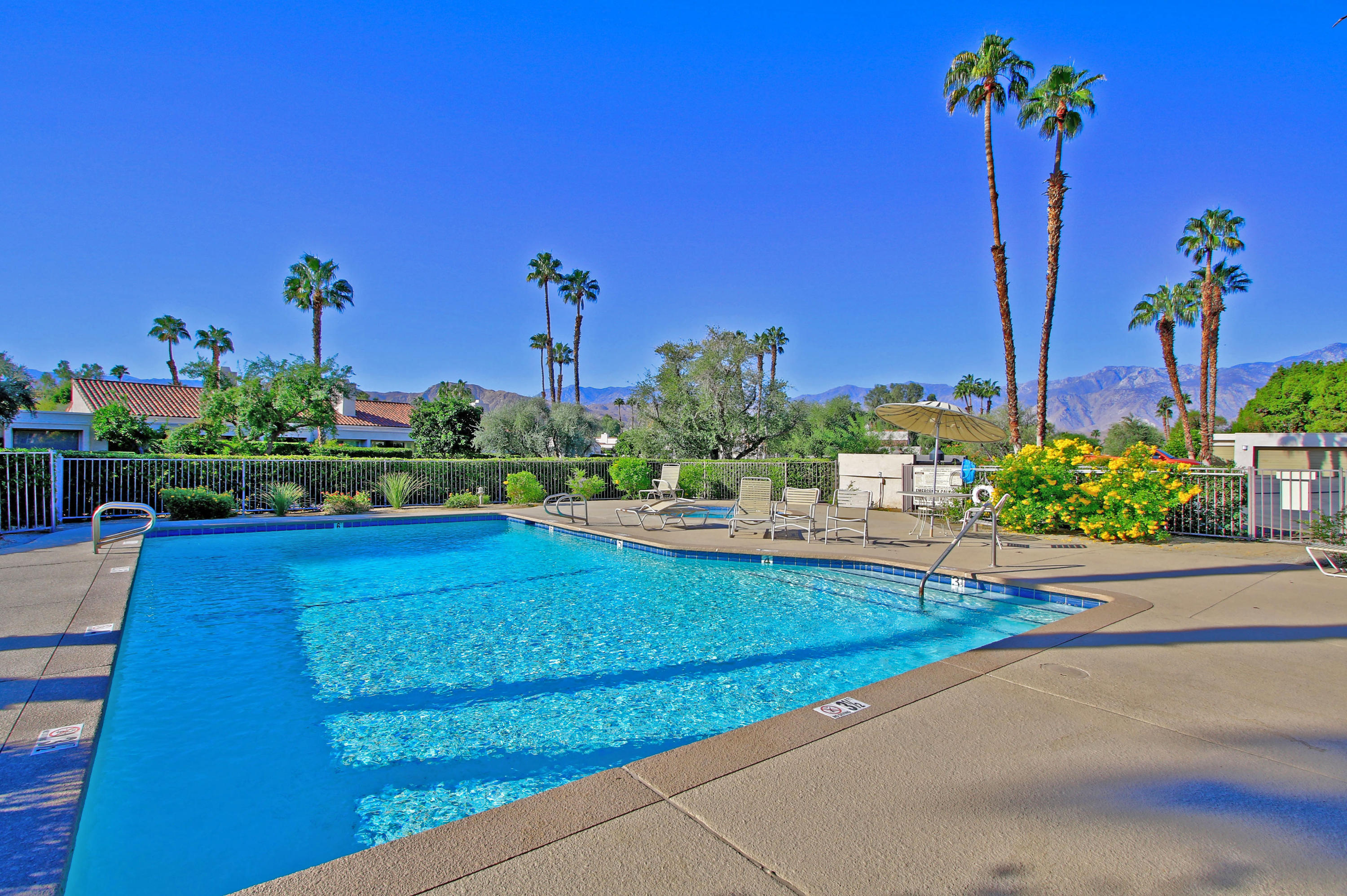 924 Inverness Drive Rancho Mirage, CA 92270 - Photo 43 of 44 a view of a house with a yard and a sitting area