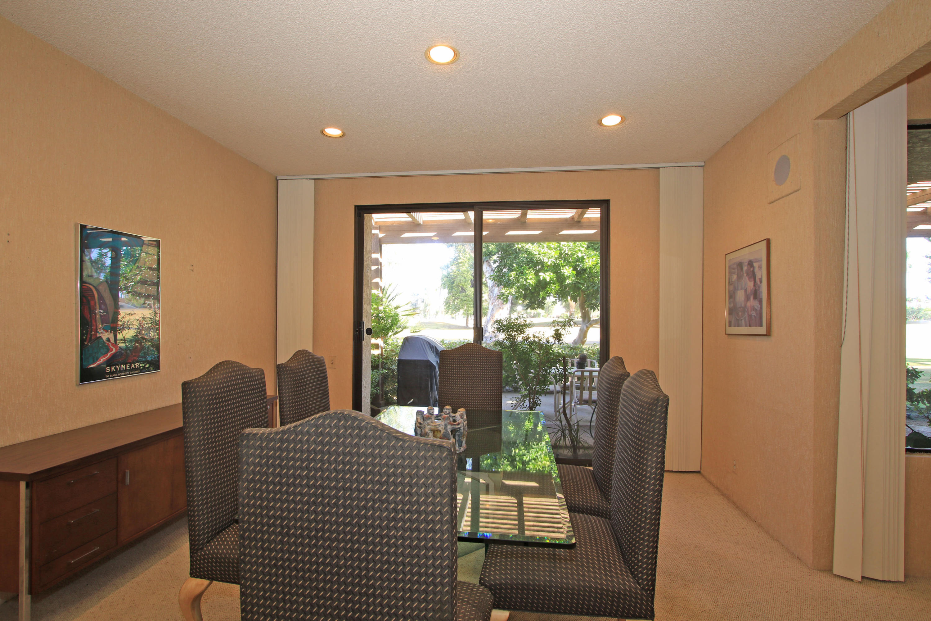 924 Inverness Drive Rancho Mirage, CA 92270 - Photo 5 of 44 a dining room with furniture and a floor to ceiling window