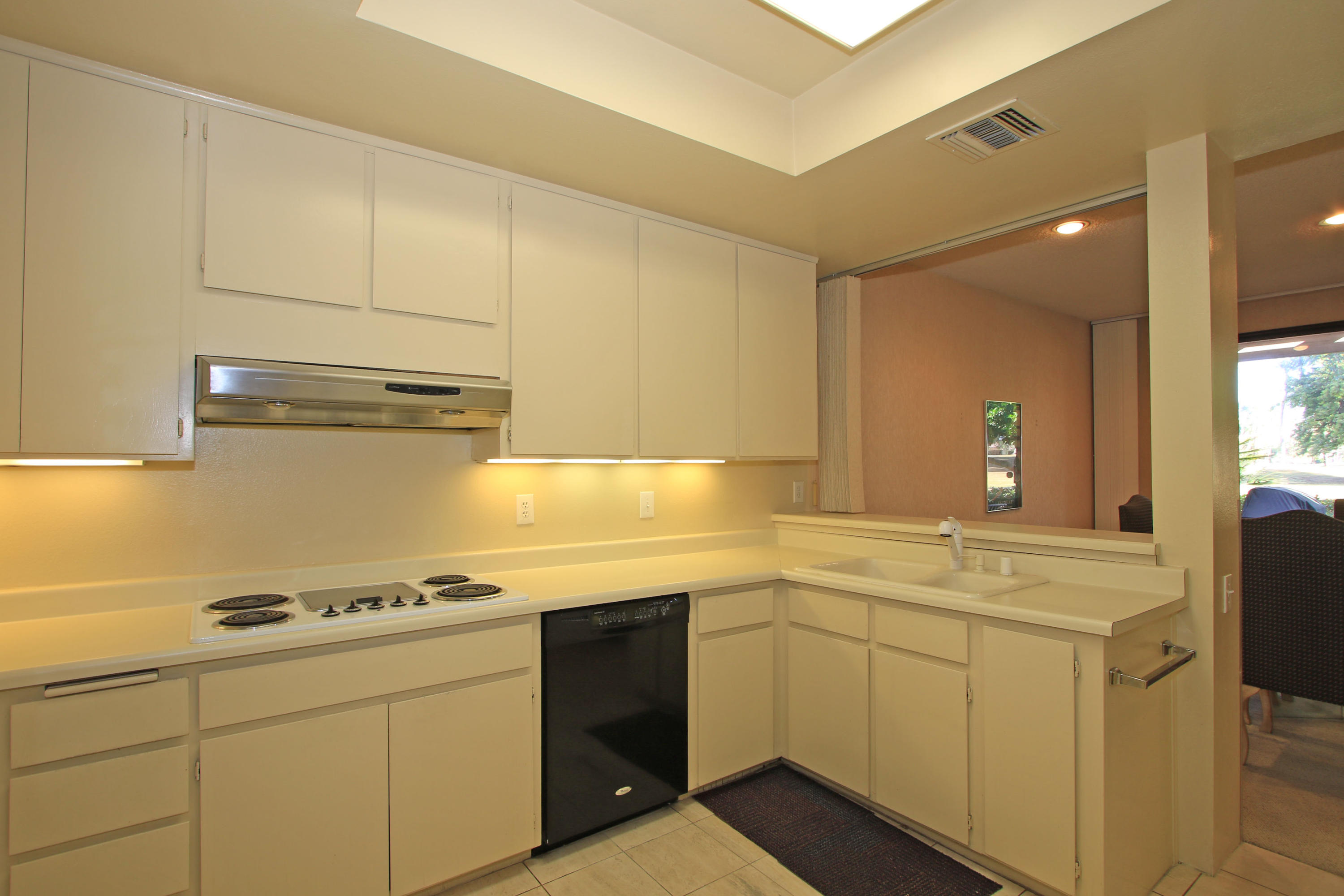 924 Inverness Drive Rancho Mirage, CA 92270 - Photo 6 of 44 a kitchen with a sink cabinets and appliances