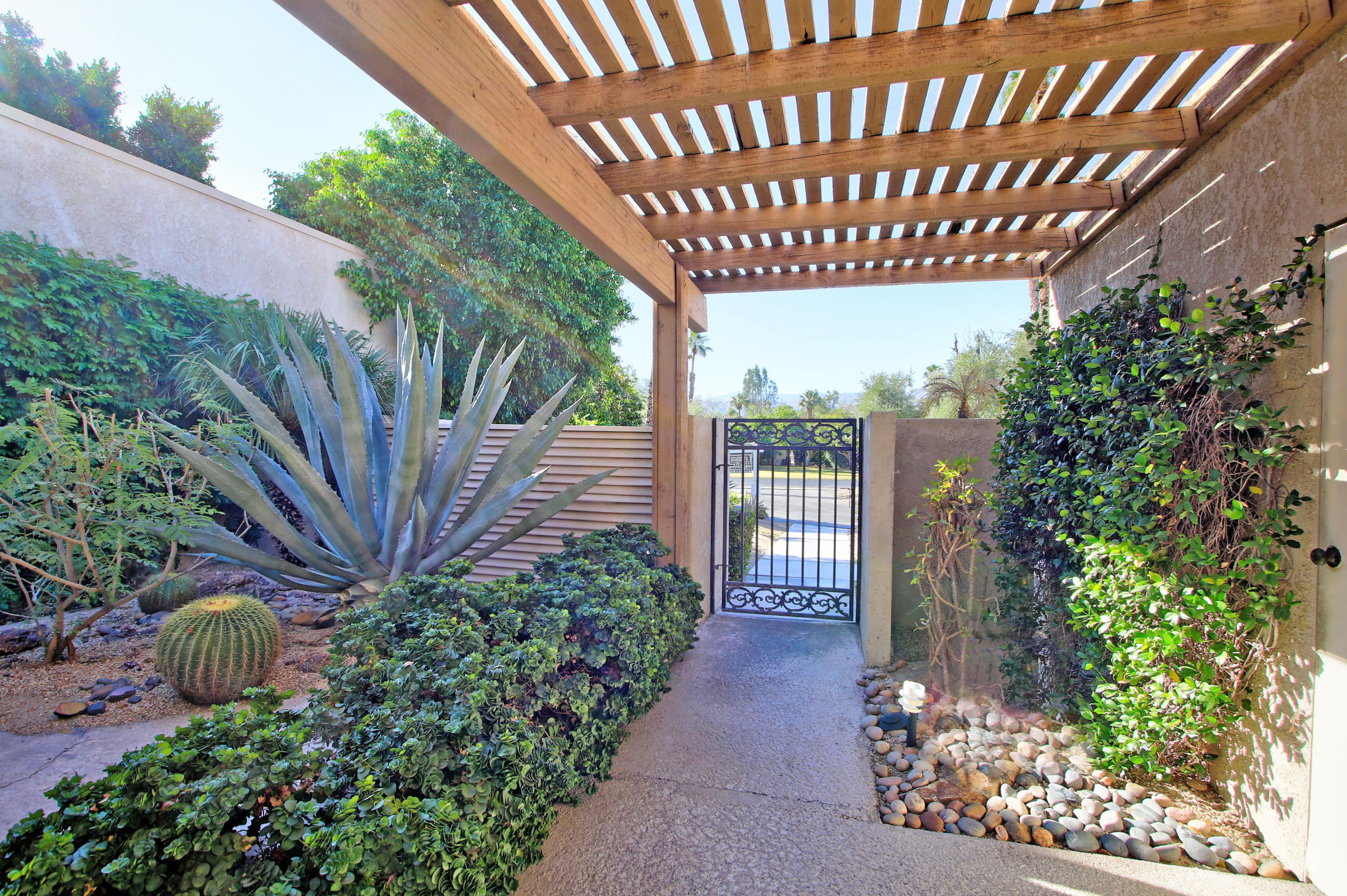924 Inverness Drive Rancho Mirage, CA 92270 - Photo 9 of 44 a view of a porch with garden