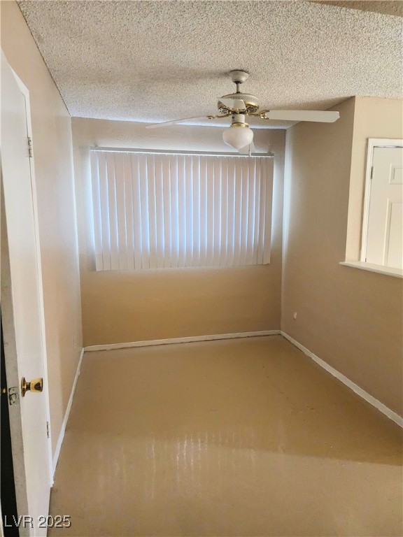 2308 Seco Adobe Circle North Las Vegas, NV 89030 - Photo 6 of 11 Empty room with a textured ceiling and ceiling fan