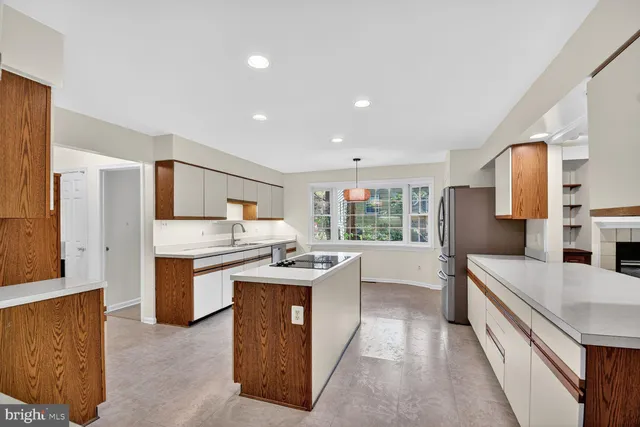 a kitchen with stainless steel appliances granite countertop a stove and a refrigerator
