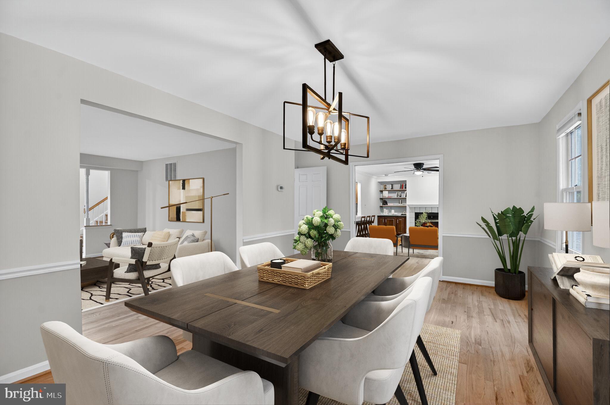 11902 Bernard Drive Silver Spring, MD 20902 - Photo 12 of 47 a view of a dining room with furniture wooden floor and chandelier