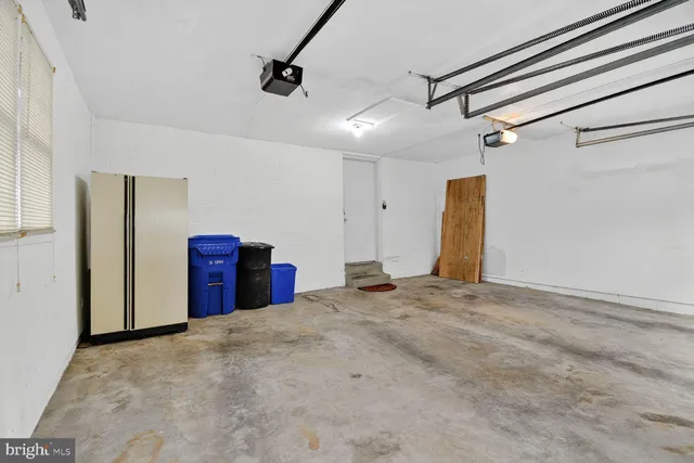 a view of an empty room with a cabinet