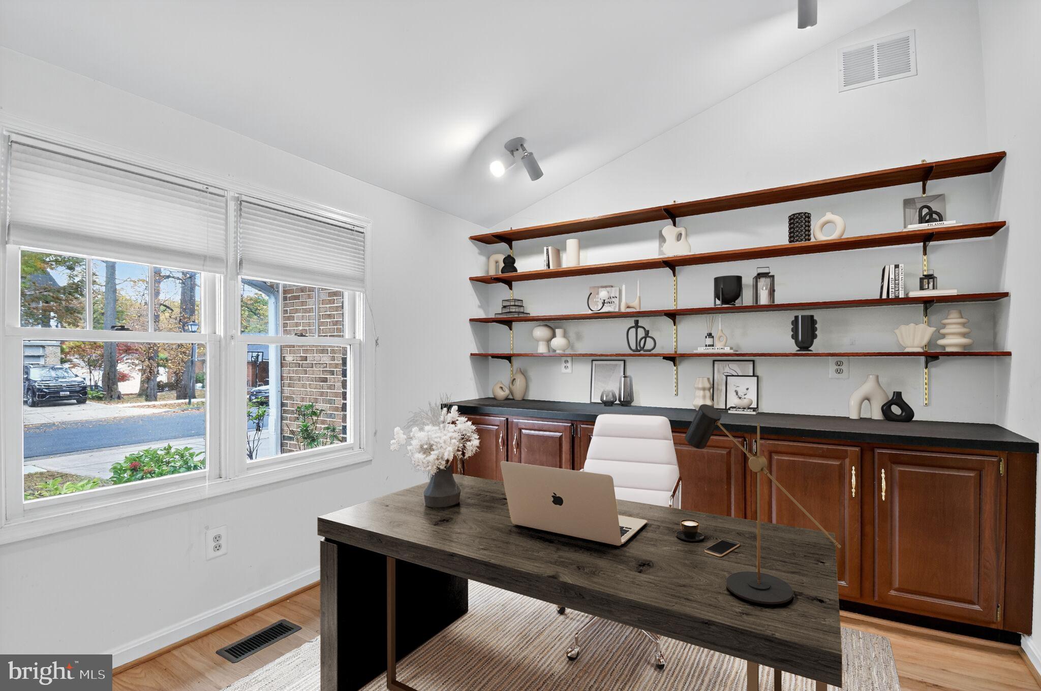 11902 Bernard Drive Silver Spring, MD 20902 - Photo 22 of 47 a view of a workspace with furniture and window