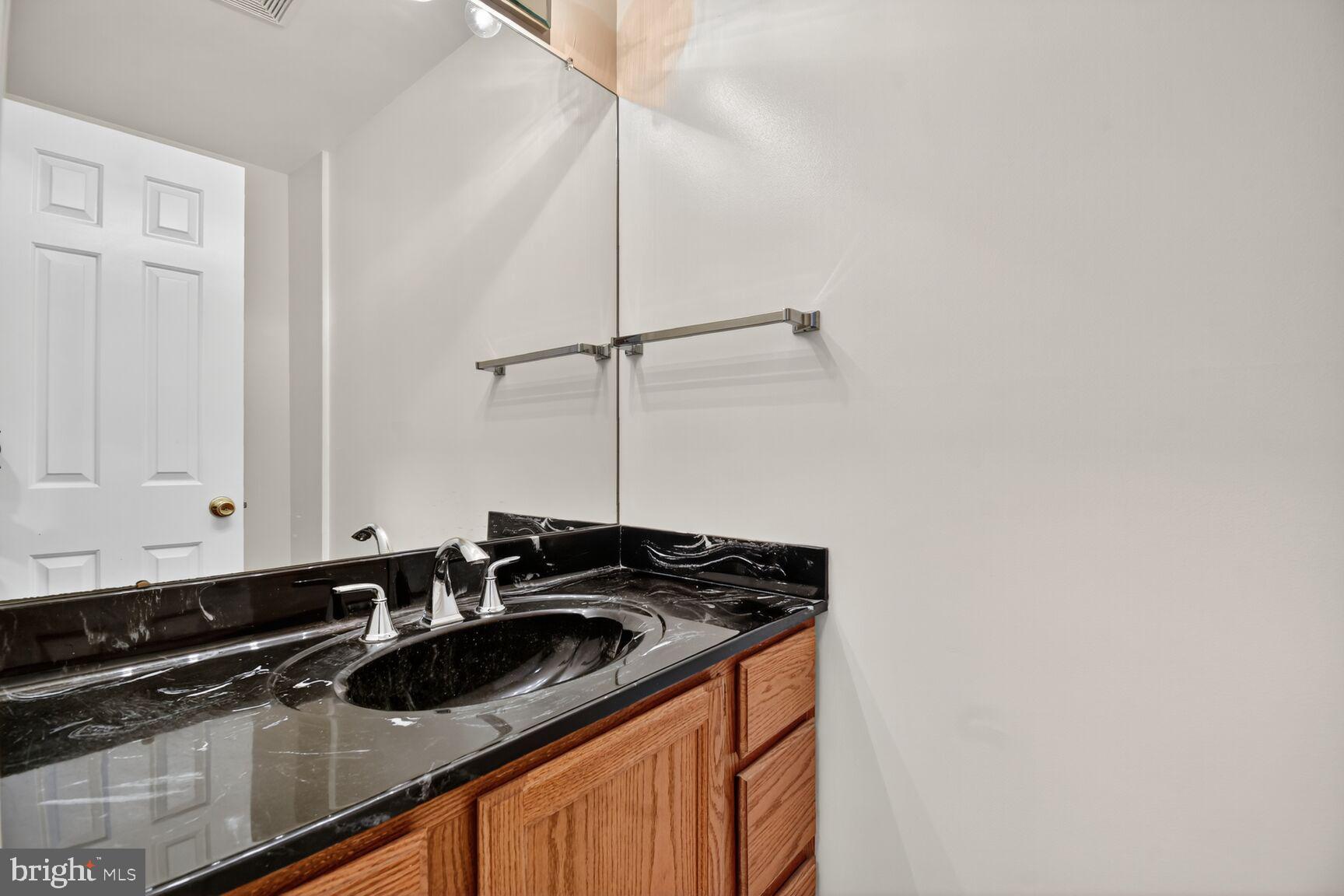 11902 Bernard Drive Silver Spring, MD 20902 - Photo 24 of 47 a view of a sink and dishwasher with wooden floor