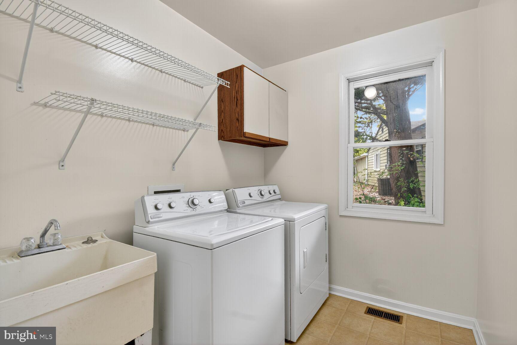 11902 Bernard Drive Silver Spring, MD 20902 - Photo 25 of 47 a utility room with dryer and washer