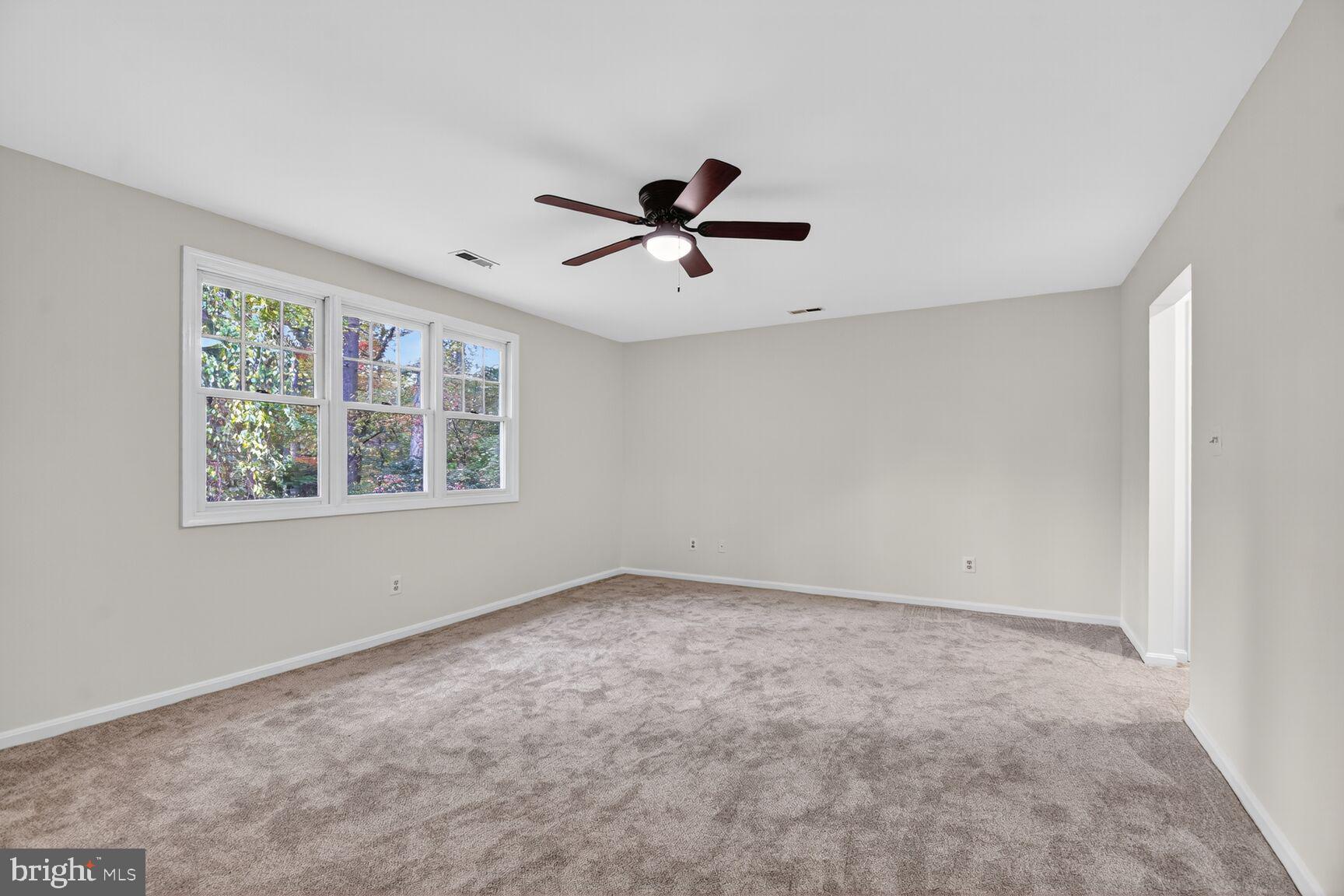 11902 Bernard Drive Silver Spring, MD 20902 - Photo 33 of 47 wooden floor in an empty room with a window