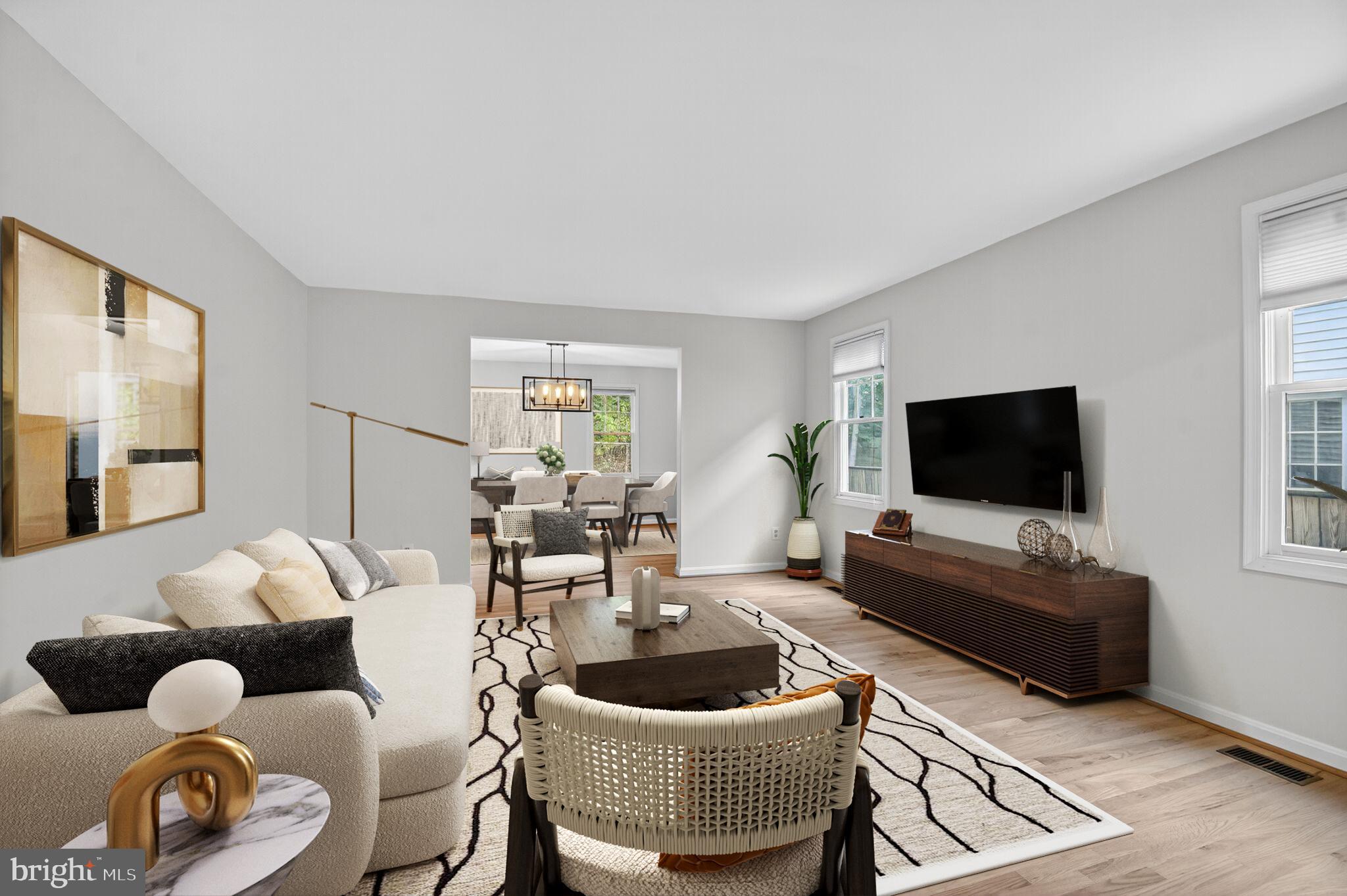 11902 Bernard Drive Silver Spring, MD 20902 - Photo 6 of 47 a living room with furniture and a flat screen tv