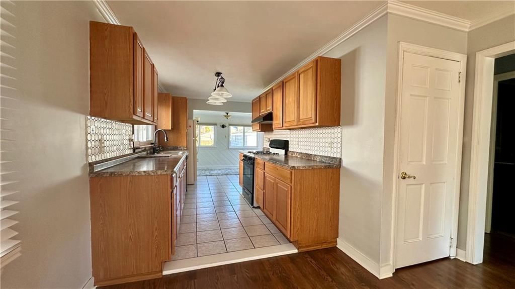 111 South Atlantic Avenue Cheswick, PA 15024 - Photo 12 of 43 a kitchen with stainless steel appliances granite countertop a refrigerator a stove and a wooden floors