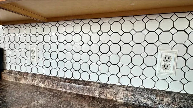 a wall with a white wall and a window