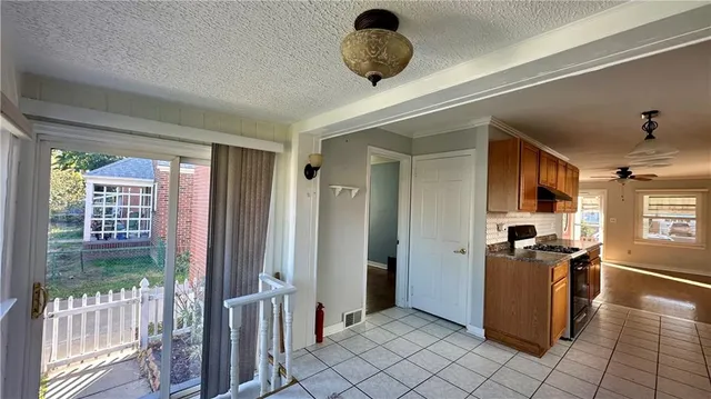 a view of entryway with wooden floor and livingroom