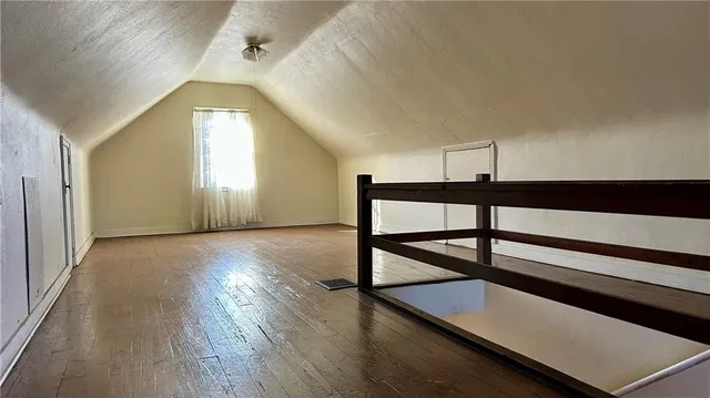 a view of a livingroom with furniture and hardwood floor