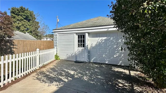 a view of a house with a wooden deck