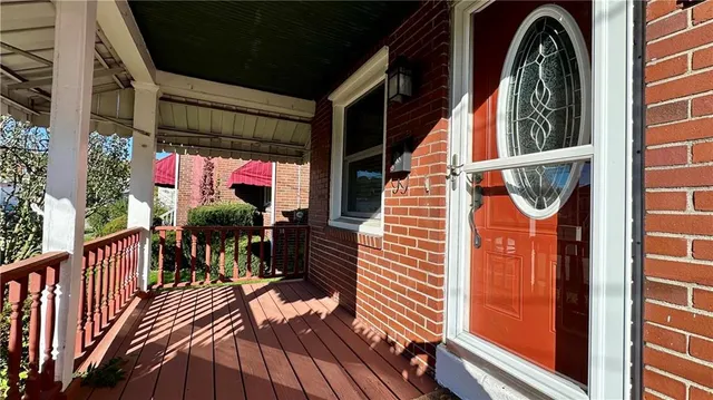 a view of a balcony with furniture
