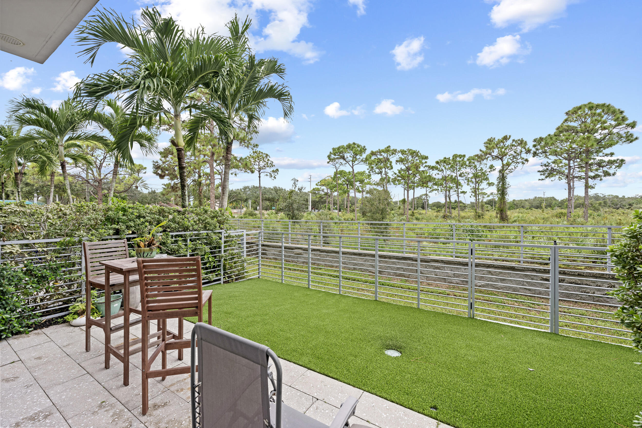1811 Northwest 42nd Drive Boca Raton, FL 33431 - Photo 39 of 51 a view of a chairs and table in the patio