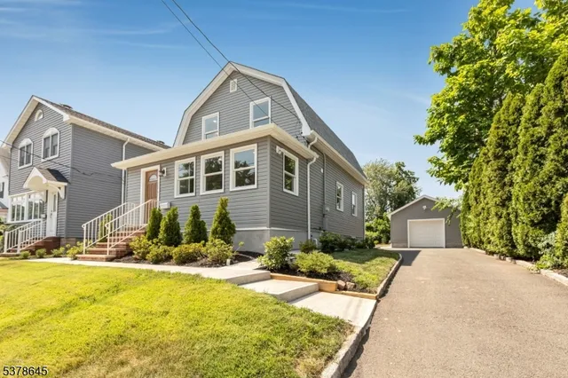 a view of swimming pool with palm trees