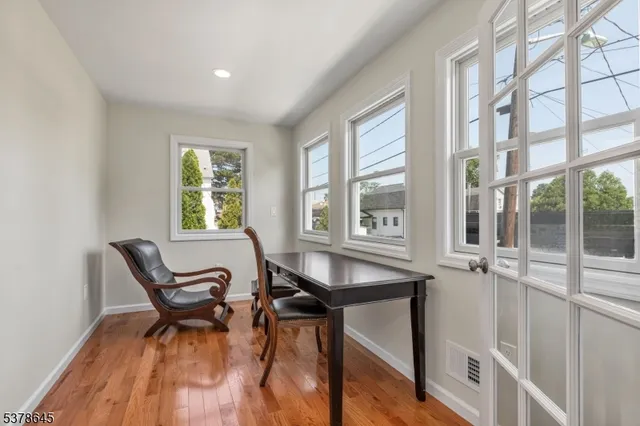 a dining room with furniture and windows