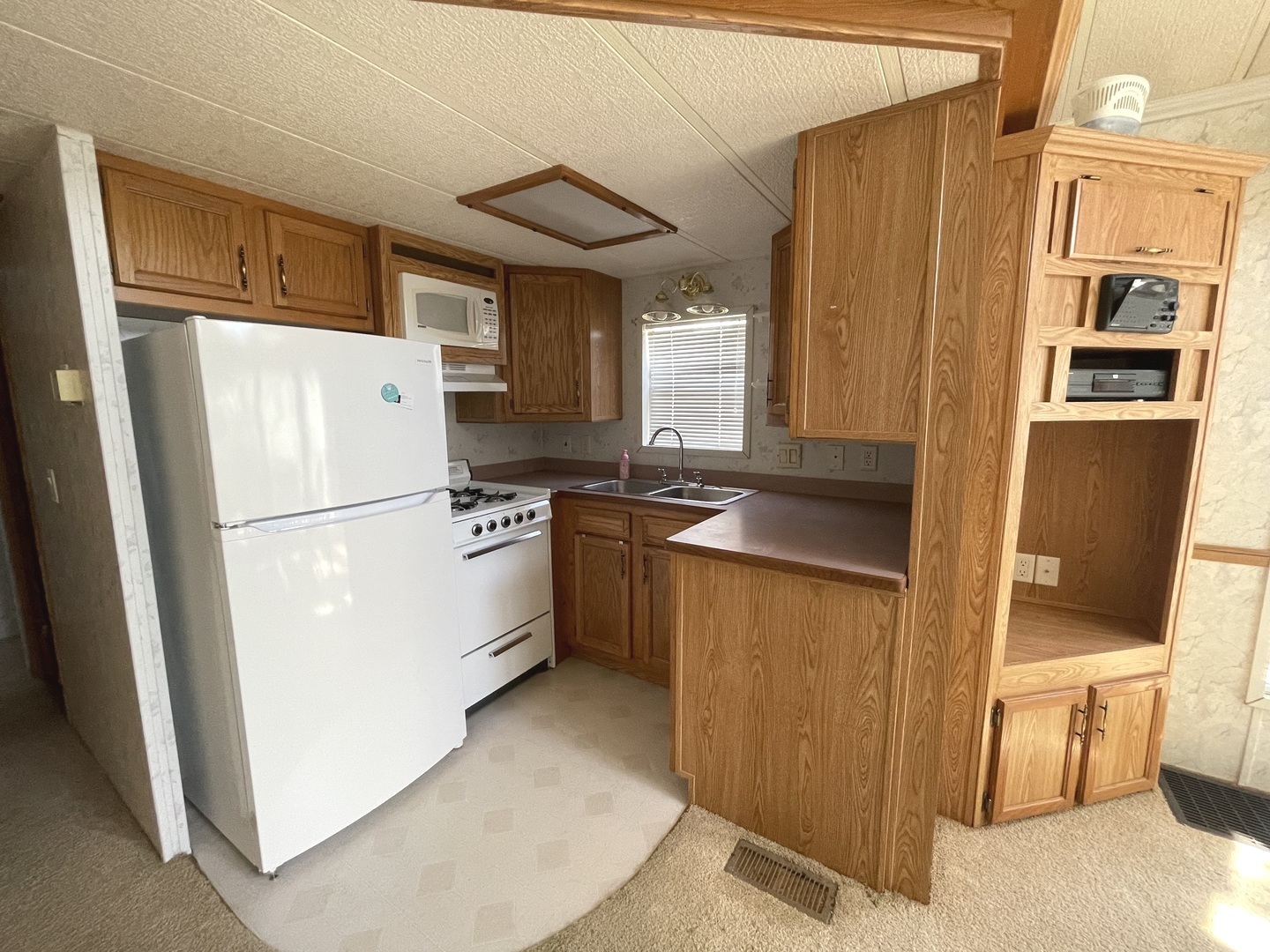 3-71 Woodhaven Lakes Sublette, IL 61367 - Photo 17 of 27 a kitchen with stainless steel appliances a refrigerator and a stove