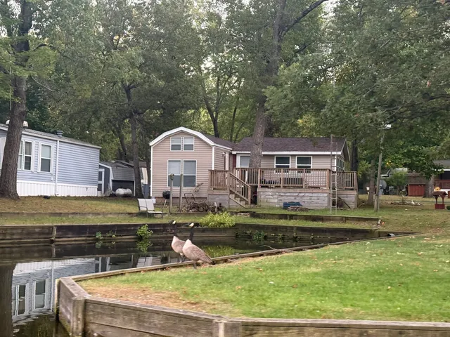 a view of a lake with a house in the background