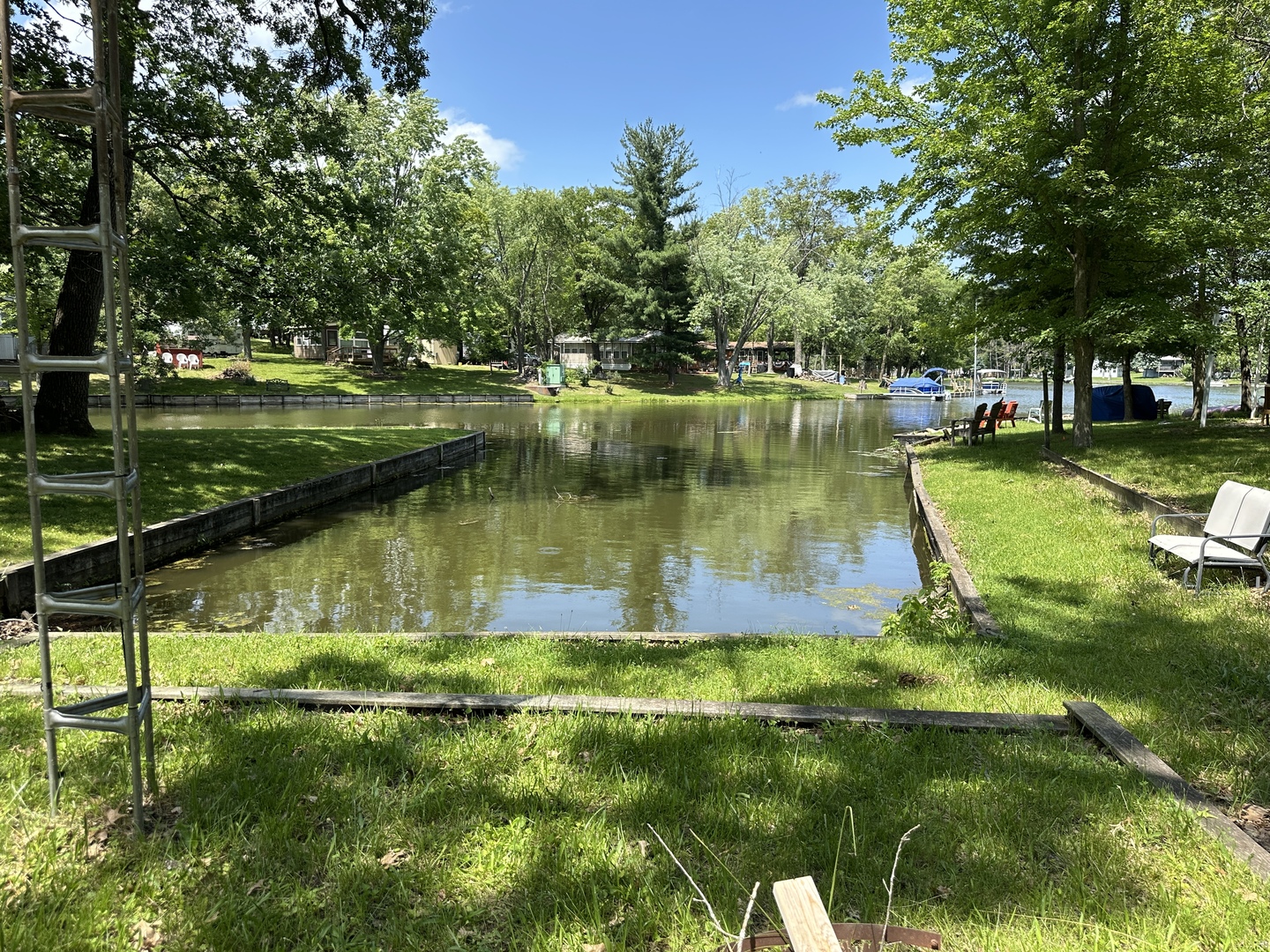 3-71 Woodhaven Lakes Sublette, IL 61367 - Photo 4 of 27 a view of a lake with a house in the background