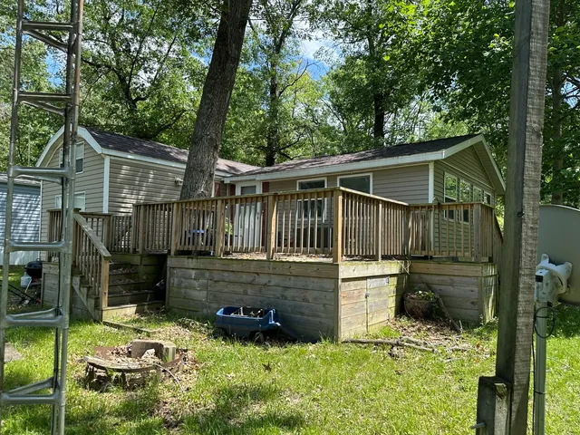 a view of hallway with stairs and wooden floor